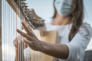Clinical Musician playing harp
